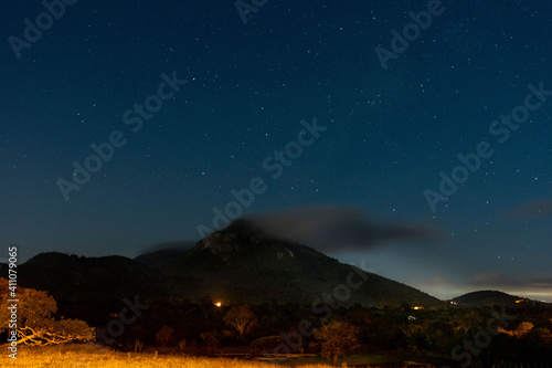 Mountain night stars and clouds