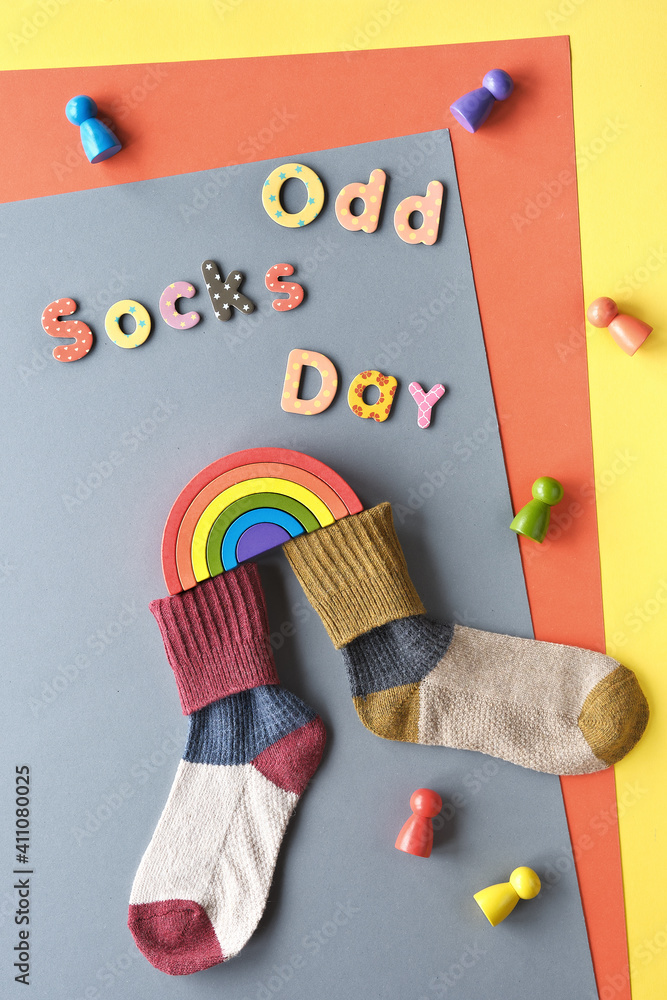 Obraz premium Odd Socks Day text. Initiative against bullying by Anti-bullying alliance on November 16. Celebrate that day by wearing mismatched socks to school or workplace.