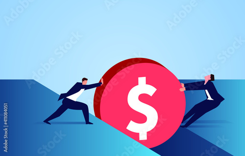 Two businessmen work hard to pull out the gold coin stuck in the crack