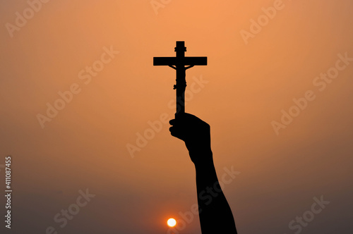 Fototapeta Black shadow glorifies the cross of God.