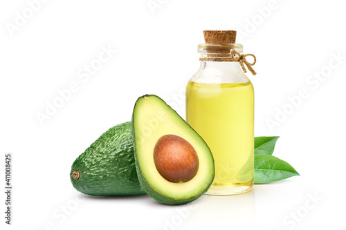 Avocado oil with avocado fruit and leaves isolated on white background.