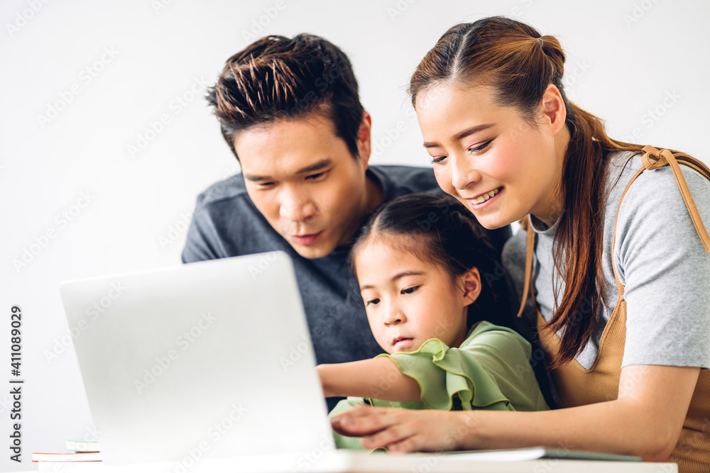 Portrait enjoy happy smiling love asian family father and mother with little asian girl learning and looking at laptop computer studying with online education e-learning system with teacher at home Portrait enjoy happy smiling love asian family father and mother with little asian girl learning and looking at laptop computer studying with online education e-learning system with teacher at home