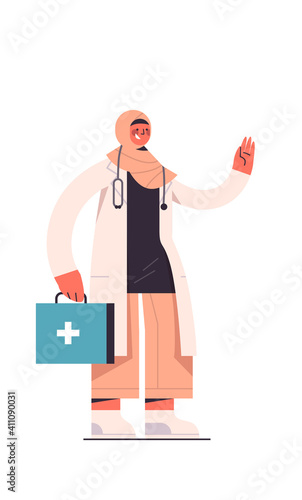 arab female doctor in uniform holding first aid kit healthcare medicine concept arabic medical worker standing pose vertical isolated full length vector illustration