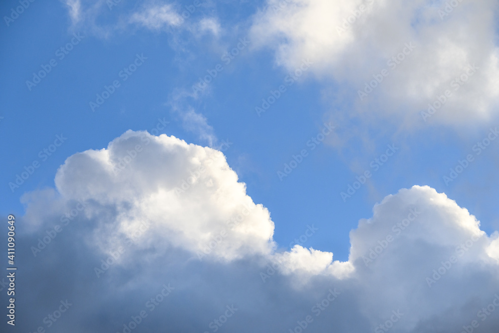 Dramatic and glowing cloudscape of blue sky and white and gray clouds as a nature background
Dramatic and glowing cloudscape of blue sky and white and gray clouds as a nature background