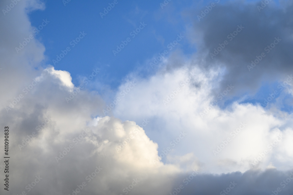 Dramatic and glowing cloudscape of blue sky and white and gray clouds as a nature background
Dramatic and glowing cloudscape of blue sky and white and gray clouds as a nature background