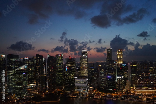 Aerial view of Skyscraper and Marina Bay area at night in Singapore -                                                       