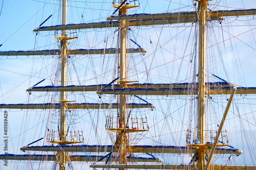 Masts and rigging of a sailing ship against sky Masts and rigging of a sailing ship against sky