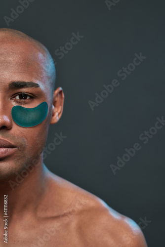 Murais de parede Half of man face with a single under eye patch