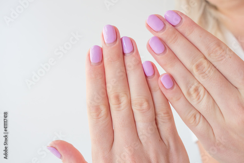Regrown manicure. Female hand with regrown nails before correcting gel polish. Well-groomed hands. copy space trending. Place for text