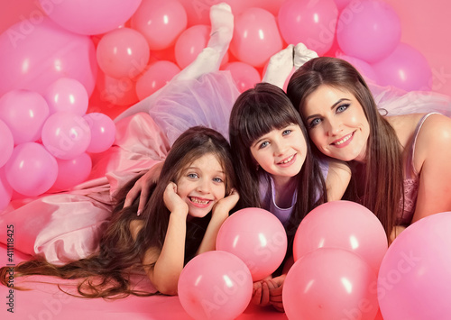Family, children, mother with party balloons. Birthday, happiness, childhood. Mother and kids in balloons, mothers day.