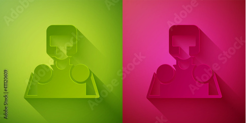 Paper cut Medieval knight icon isolated on green and pink background. Paper art style. Vector.