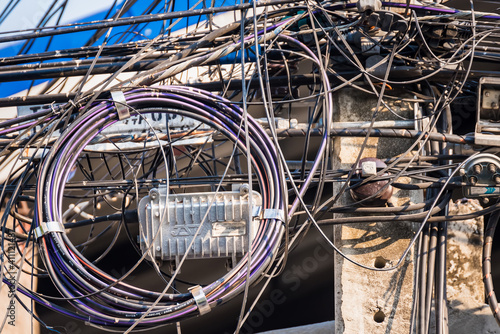 Bangkok, Thailand - February, 04, 2021 : Messy cable electricity post in Bangkok, Thailand