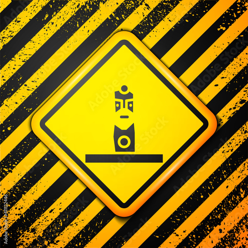 Black Slavic pagan idol icon isolated on yellow background. Antique ritual wooden idol. Warning sign. Vector.