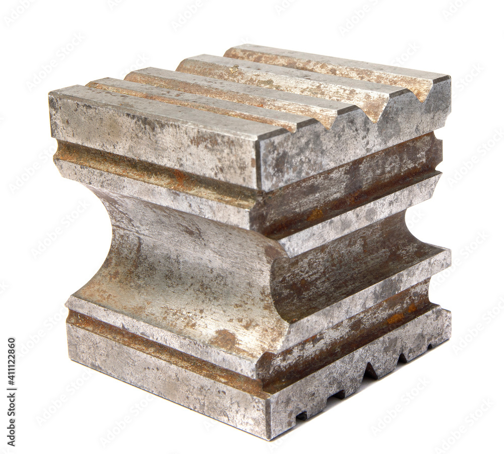 Metal cube with shaped recesses. Design cube. A tool for a jeweler. Metal cube with shaped recesses. Design cube. A tool for a jeweler.
