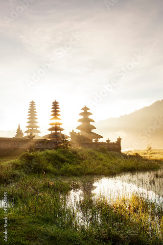 Morning view at Tamblingan Lake, Singaraja Bali. this lake part of twin lake in north of Bali. here have a Hindu Temple. this place very beautiful when you come in sunrise time photo