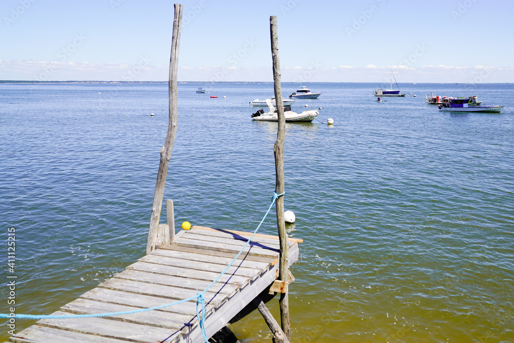 boat parked at low tide in bay Arcachon beach France in Le Canon oyster farm Village boat parked at low tide in bay Arcachon beach France in Le Canon oyster farm Village