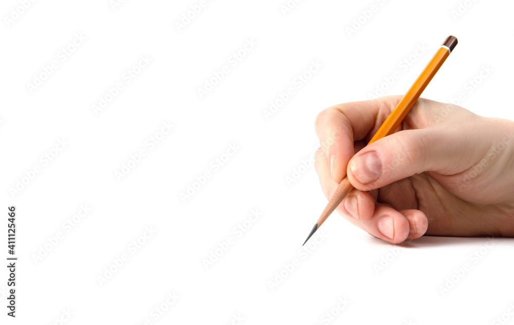 The hand holds an acutely sharpened pencil. The hand holds an acutely sharpened pencil.