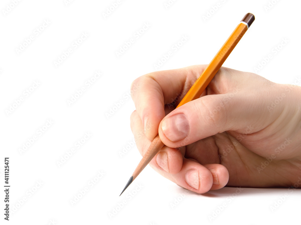The hand holds an acutely sharpened pencil. The hand holds an acutely sharpened pencil.