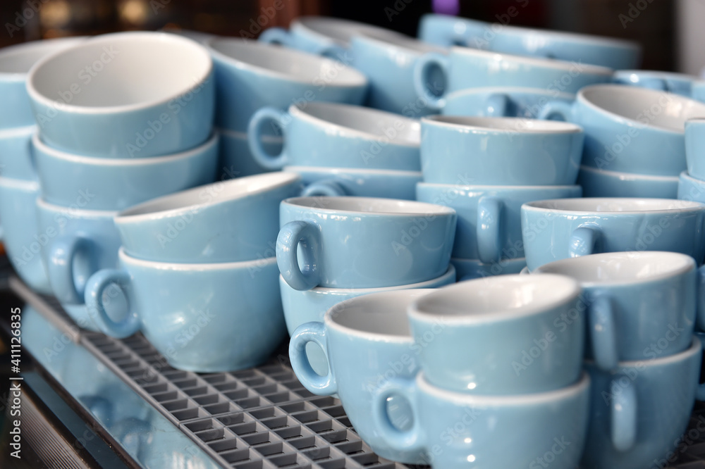 Blue coffee cups in a restaurant. Blue coffee cups in a restaurant.