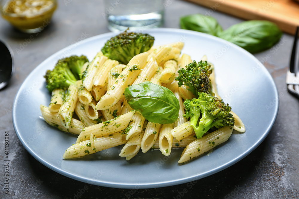 Delicious pasta with broccoli on dark background, closeup Delicious pasta with broccoli on dark background, closeup
