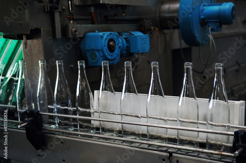 Transparent wine bottles on the production line.