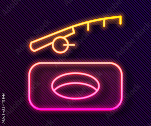 Glowing neon line Winter fishing icon isolated on black background. Vector.