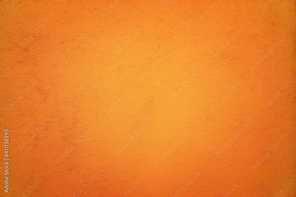 Naklejka premium Red Orange colored abstract background with light glow and fine texture.