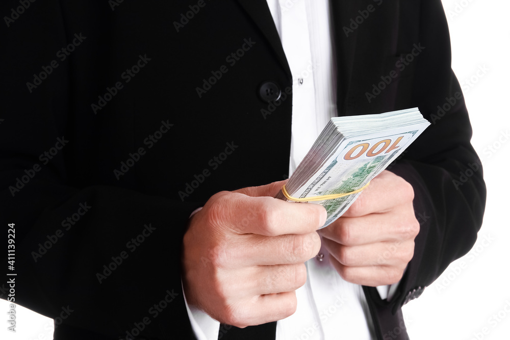Business man holding money on white background