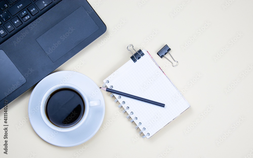 A cup of black coffee on a light background A cup of black coffee on a light background