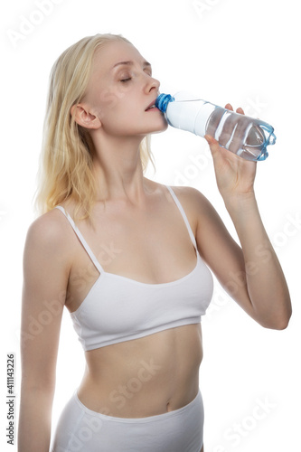 girl hold the bottle of drinking water on white background