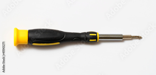 A screwdriver for the repair of small devices, watches, optics. Close-up.
