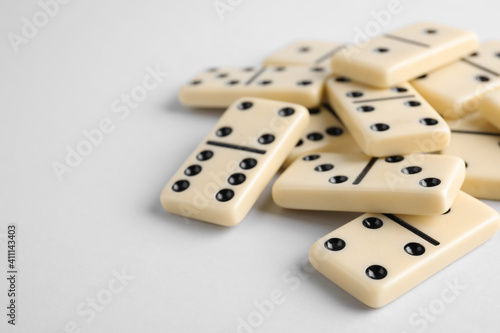 Domino tiles on white background. Space for text