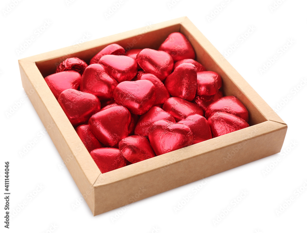 Heart shaped chocolate candies in box on white background Heart shaped chocolate candies in box on white background