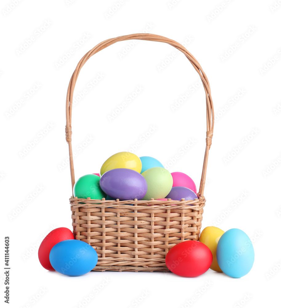 Wicker basket with bright painted Easter eggs on white background Wicker basket with bright painted Easter eggs on white background
