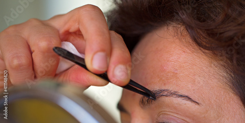 Plucking eyebrows