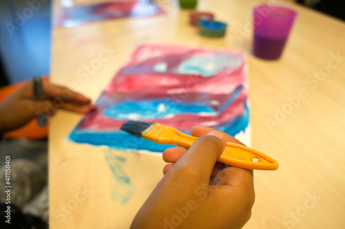 child draws paints