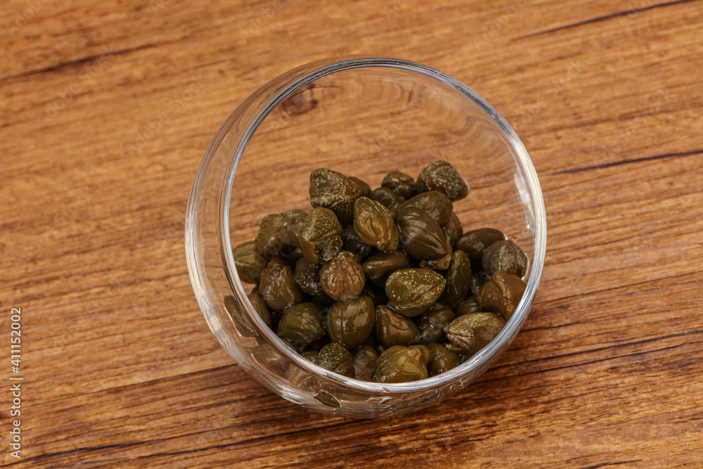 Tasty capers in the bowl Tasty capers in the bowl