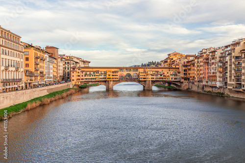 Arno river leading to the famous bridge Ponte Vecchio at the beautiful evening in Florence, Italy