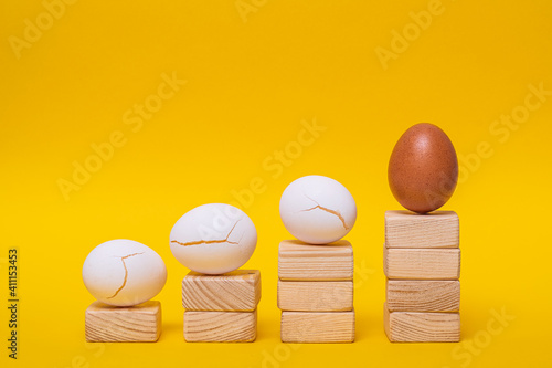 An abstraction, a metaphor, an impromptu career ladder, there is a whole and indestructible golden egg and three white and broken eggs lie on the way to the goal.