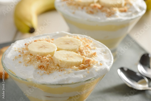 Banana slices and cookie crumbs on whipped cream mousse