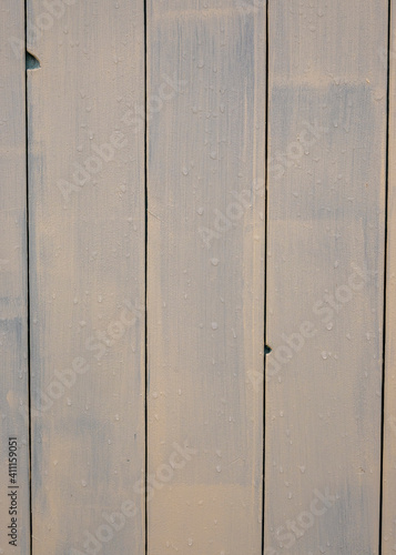 Painted old wooden panels with rain drops on 