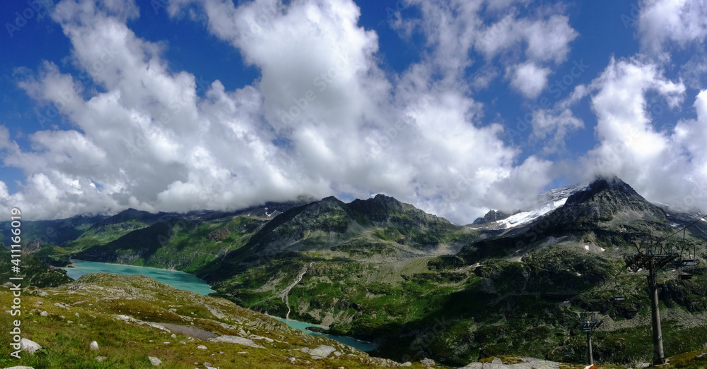 view to a mountains valley with a wonderful turquoise water reservoir panorama