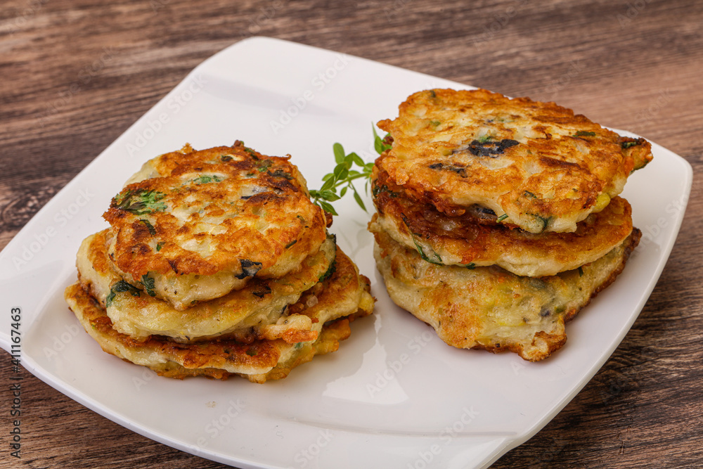 Zucchini pancakes with herbs and spices Zucchini pancakes with herbs and spices