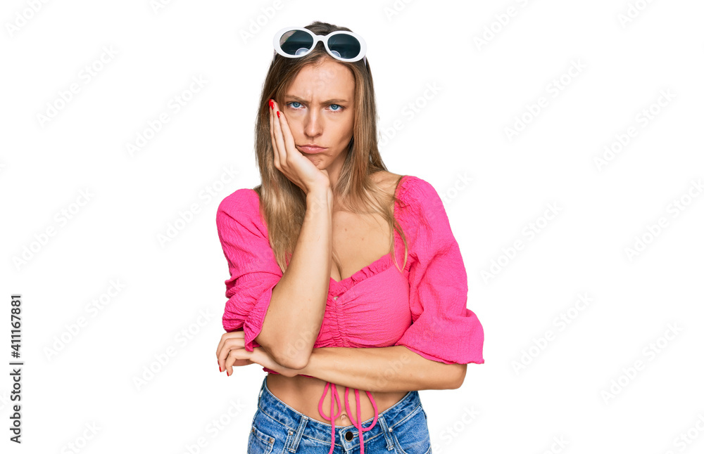 Fototapeta premium Beautiful caucasian woman wearing sunglasses and summer style thinking looking tired and bored with depression problems with crossed arms.