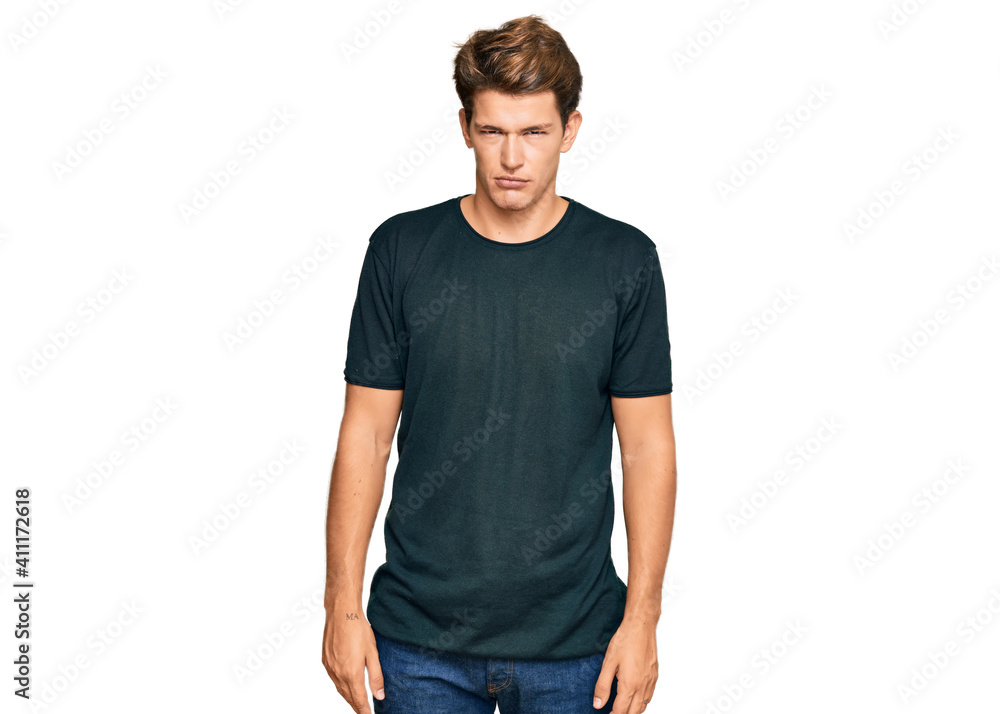 Handsome caucasian man wearing casual clothes skeptic and nervous, frowning upset because of problem. negative person. Handsome caucasian man wearing casual clothes skeptic and nervous, frowning upset because of problem. negative person.