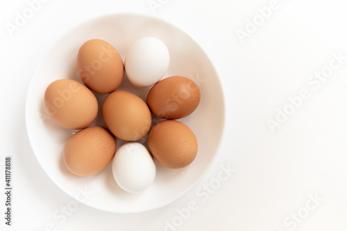 Group brown fresh eggs, isolated on white background.