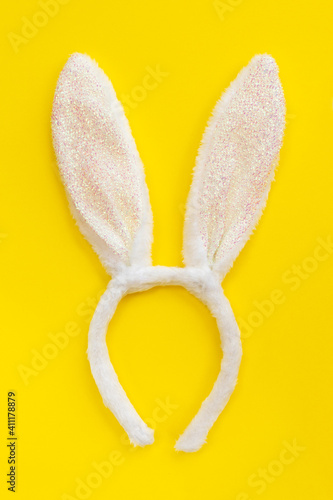 Easter bunny ears, isolated on yellow background. Free space for design. © PhotoPaper