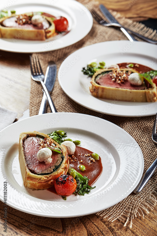 Easter meat roll, meatloaf for Easter dinner. Beautifully decorated catering banquet table with different food snacks and appetizers Easter meat roll, meatloaf for Easter dinner. Beautifully decorated catering banquet table with different food snacks and appetizers