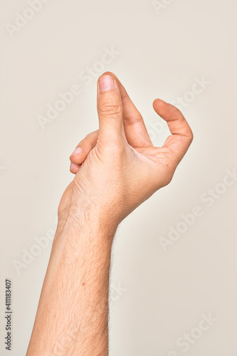 Hand of caucasian young man showing fingers over isolated white background snapping fingers for success  easy and click symbol gesture with hand