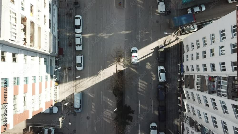 Aerial view of crosswalk and empty streets in quarantine days. sunlight seen through buildings. Aerial view of crosswalk and empty streets in quarantine days. sunlight seen through buildings.